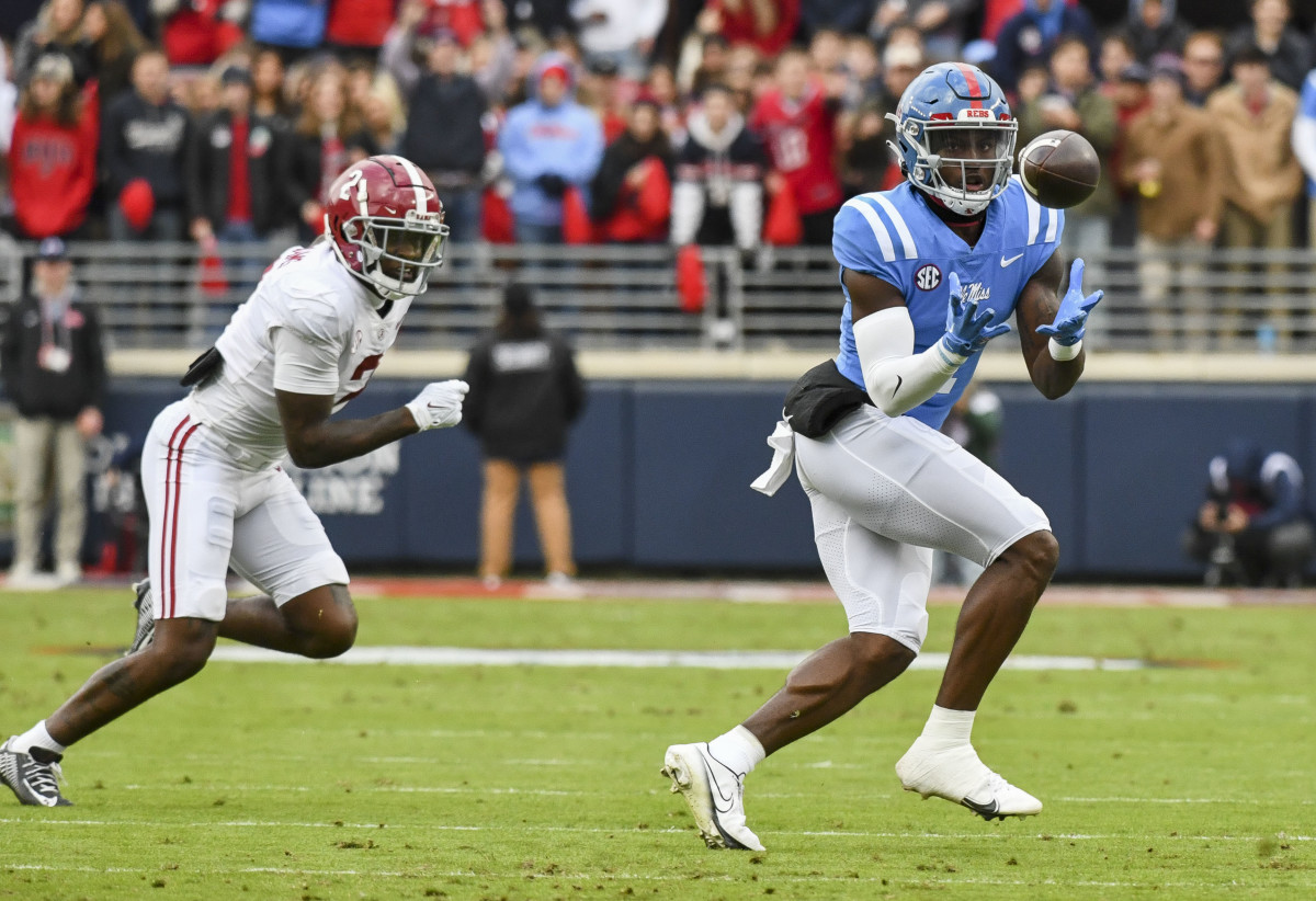 Nov 12, 2022; Oxford, Mississippi, USA; Ole Miss wide receiver Jonathan Mingo (1) catches a pass with Alabama defensive back DeMarcco Hellams (2) covering at Vaught-Hemingway Stadium. Mandatory Credit: Gary Cosby Jr.-USA TODAY Sports